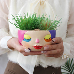 Bunter Harz Blumentopf – Modernes Gesicht Design Desktop