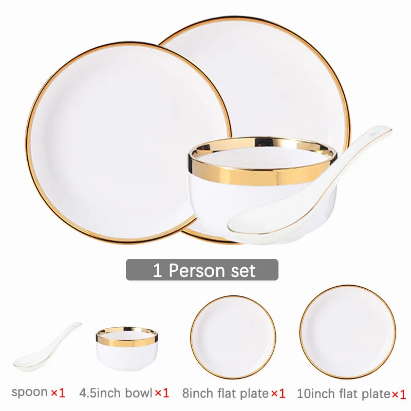 Elegantes Set aus weissen Porzellantellern mit Goldrand für Esstisch